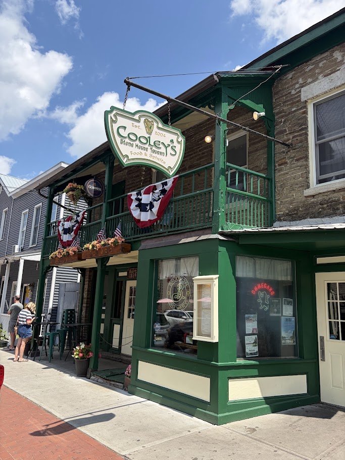 Stone tavern exterior on a quiet street.